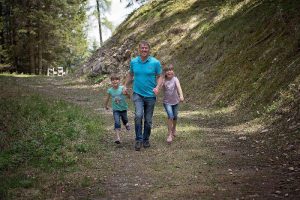 family camping with kids walking